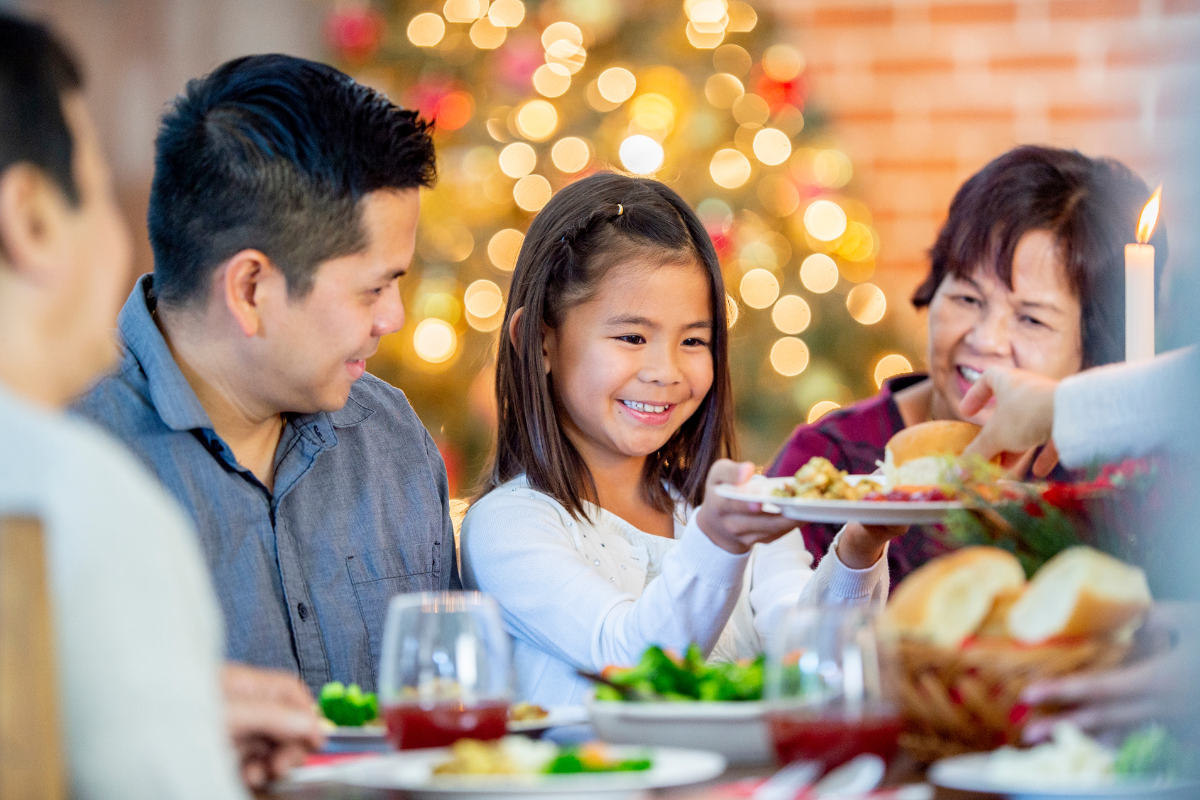 A family eats a holiday dinner